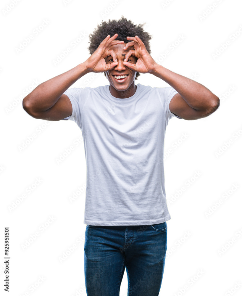 Afro american man over isolated background doing ok gesture like binoculars sticking tongue out, eyes looking through fingers. Crazy expression.