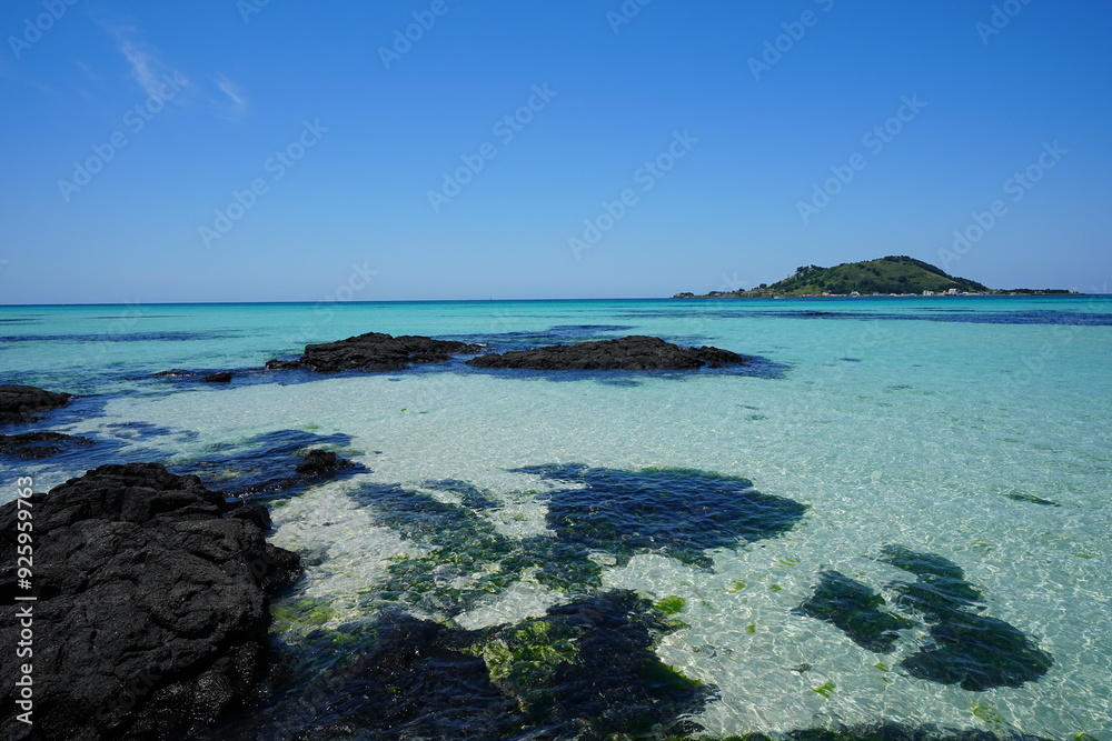 shoaling beach with rocks and clear water shoaling beach with rocks and clear water