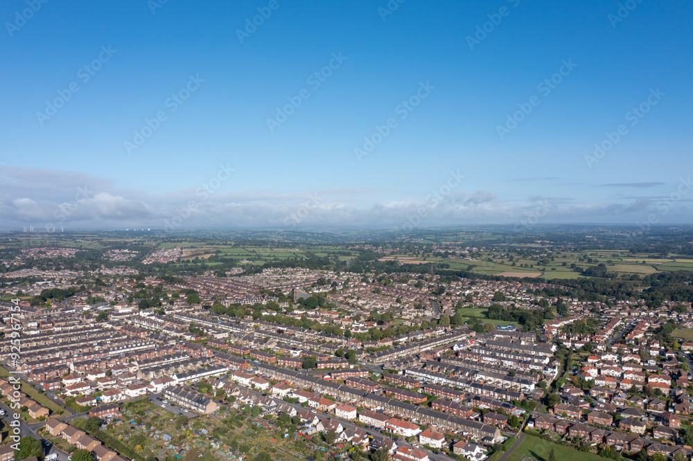 Aerial drone photo of the British town of Harrogate in North Yorkshire England which is east of the Yorkshire Dales in the summer time showing streets of residential housing estates from above