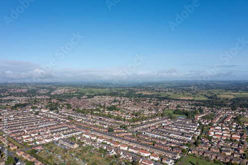 Obraz na płótnie Aerial drone photo of the British town of Harrogate in North Yorkshire England which is east of the Yorkshire Dales in the summer time showing streets of residential housing estates from above w salonie