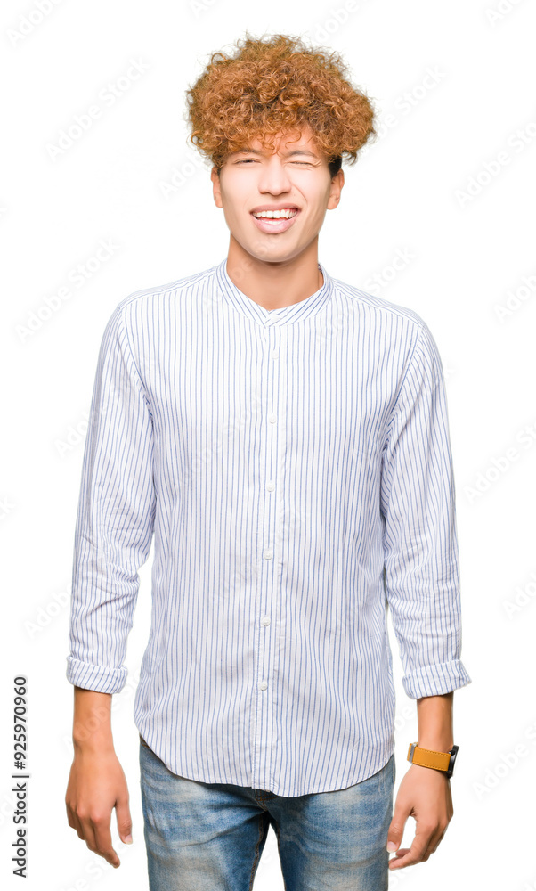 Young handsome business man with afro hair wearing elegant shirt winking looking at the camera with sexy expression, cheerful and happy face. Young handsome business man with afro hair wearing elegant shirt winking looking at the camera with sexy expression, cheerful and happy face.