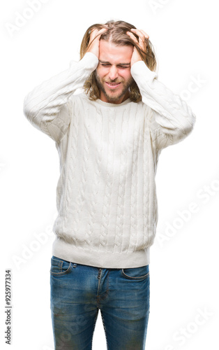 Young handsome man with long hair wearing winter sweater over isolated background suffering from headache desperate and stressed because pain and migraine. Hands on head.