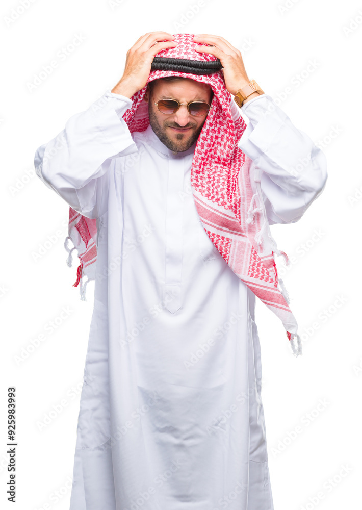 Young handsome man wearing keffiyeh over isolated background suffering from headache desperate and stressed because pain and migraine. Hands on head.
