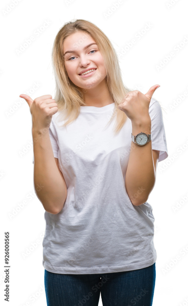 Young caucasian woman over isolated background success sign doing positive gesture with hand, thumbs up smiling and happy. Looking at the camera with cheerful expression, winner gesture. Young caucasian woman over isolated background success sign doing positive gesture with hand, thumbs up smiling and happy. Looking at the camera with cheerful expression, winner gesture.
