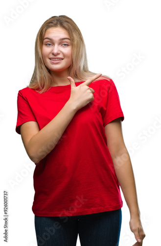 Young caucasian woman over isolated background cheerful with a smile of face pointing with hand and finger up to the side with happy and natural expression on face looking at the camera.