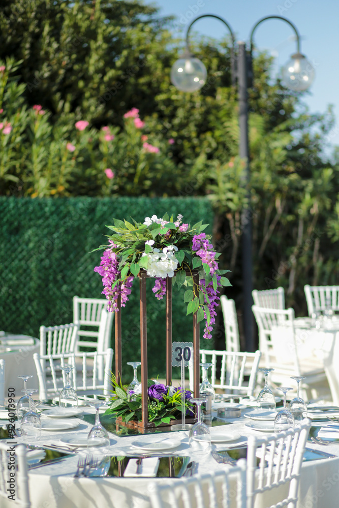 Elegant Outdoor Wedding Reception with Wisteria Floral Centerpieces