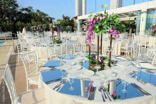 Elegant Outdoor Wedding Reception with Wisteria Floral Centerpieces