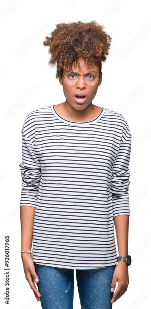 Beautiful young african american woman wearing glasses over isolated background In shock face, looking skeptical and sarcastic, surprised with open mouth Beautiful young african american woman wearing glasses over isolated background In shock face, looking skeptical and sarcastic, surprised with open mouth