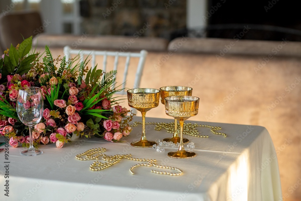 Indoor Wedding Reception: Round Tables with White and Green Floral Decor
