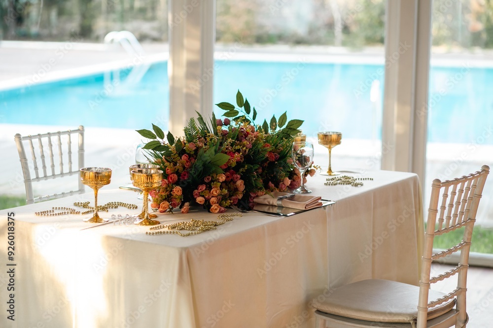 Indoor Wedding Reception: Round Tables with White and Green Floral Decor