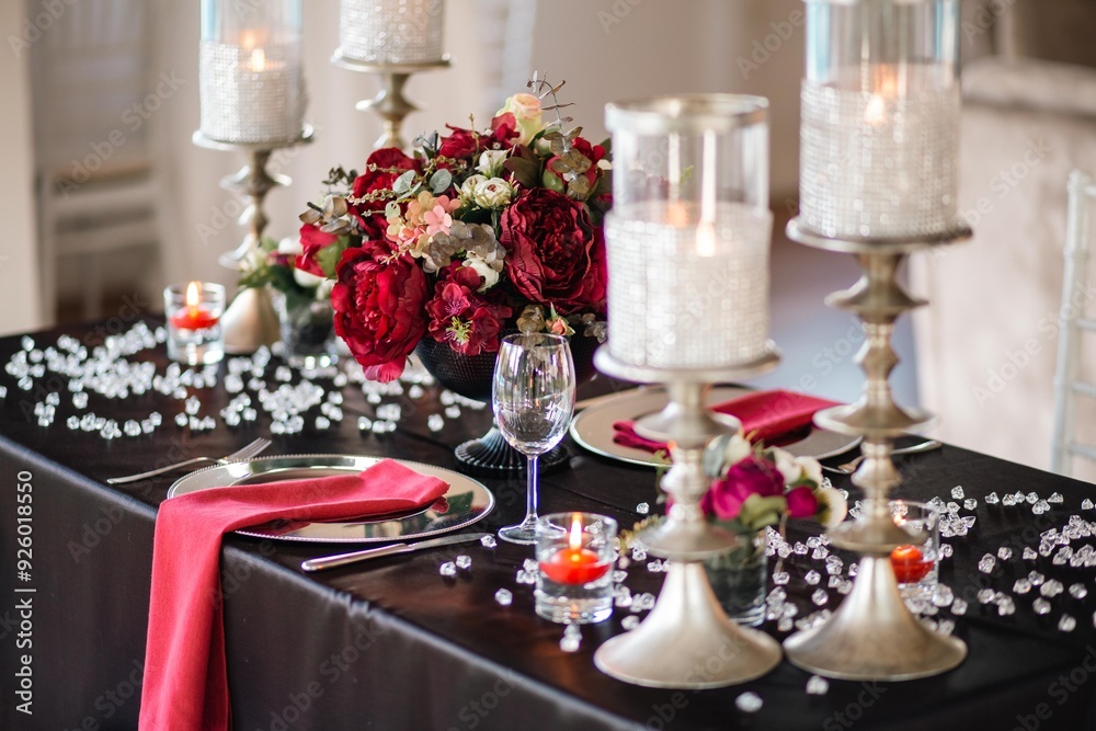 Intimate Table Setting with Floral Arrangements and Candlelight Intimate Table Setting with Floral Arrangements and Candlelight