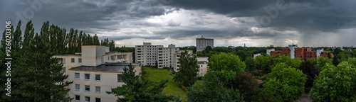 Bremen, Germany, July 16, 2024 - High angle over the suburbs with apartment blockson a cloudy, rainy day