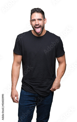 Young handsome man over isolated background sticking tongue out happy with funny expression. Emotion concept.