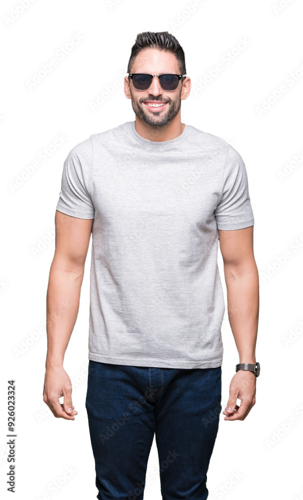 Fototapeta premium Young handsome man wearing sunglasses over isolated background with a happy face standing and smiling with a confident smile showing teeth