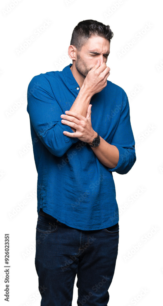 Young handsome man over isolated background smelling something stinky and disgusting, intolerable smell, holding breath with fingers on nose. Bad smells concept. Young handsome man over isolated background smelling something stinky and disgusting, intolerable smell, holding breath with fingers on nose. Bad smells concept.