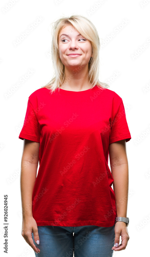 Fototapeta premium Young beautiful blonde woman wearing red t-shirt over isolated background smiling looking side and staring away thinking.