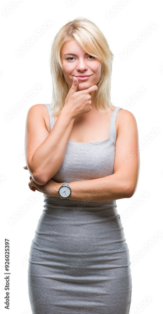 Young beautiful blonde woman over isolated background looking confident at the camera with smile with crossed arms and hand raised on chin. Thinking positive. Young beautiful blonde woman over isolated background looking confident at the camera with smile with crossed arms and hand raised on chin. Thinking positive.