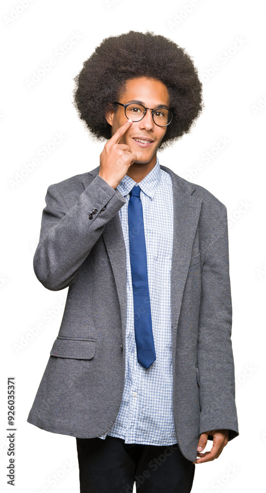 Young african american business man with afro hair wearing glasses Pointing to the eye watching you gesture, suspicious expression Young african american business man with afro hair wearing glasses Pointing to the eye watching you gesture, suspicious expression