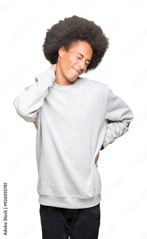 Young african american man with afro hair wearing sporty sweatshirt Suffering of neck ache injury, touching neck with hand, muscular pain Young african american man with afro hair wearing sporty sweatshirt Suffering of neck ache injury, touching neck with hand, muscular pain