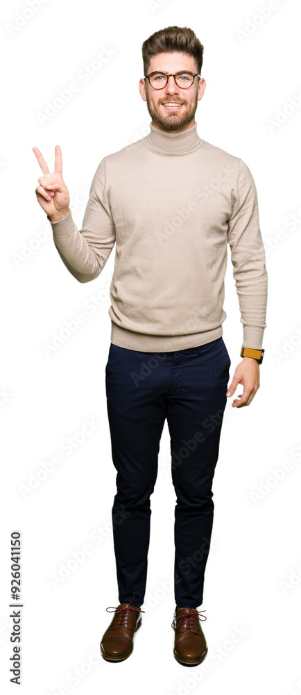 Young handsome business man wearing glasses showing and pointing up with fingers number two while smiling confident and happy. Young handsome business man wearing glasses showing and pointing up with fingers number two while smiling confident and happy.