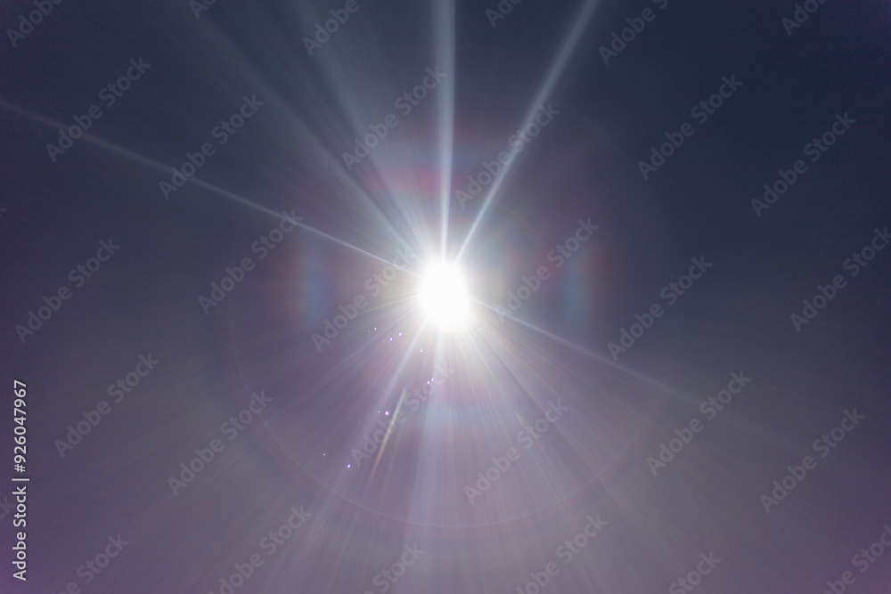 powerful light source directly hitting the camera, light beams, and the central round light source powerful light source directly hitting the camera, light beams, and the central round light source