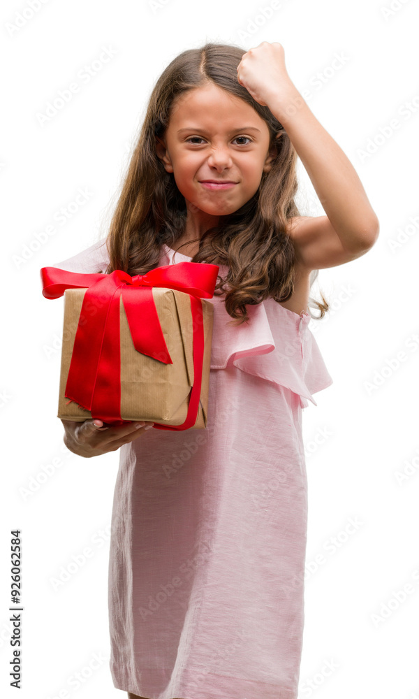 Brunette hispanic girl holding a gift annoyed and frustrated shouting with anger, crazy and yelling with raised hand, anger concept Brunette hispanic girl holding a gift annoyed and frustrated shouting with anger, crazy and yelling with raised hand, anger concept