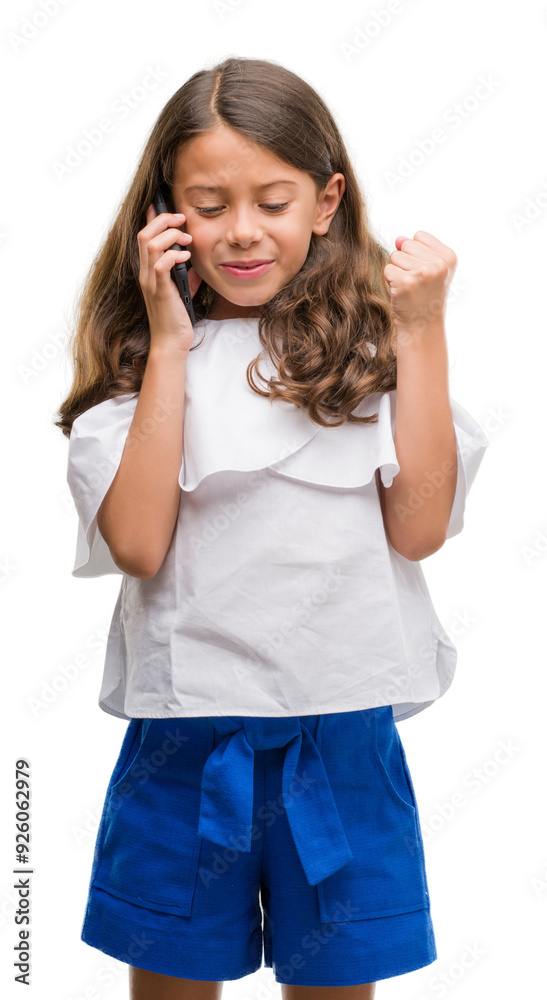 Brunette hispanic girl using smartphone screaming proud and celebrating victory and success very excited, cheering emotion Brunette hispanic girl using smartphone screaming proud and celebrating victory and success very excited, cheering emotion