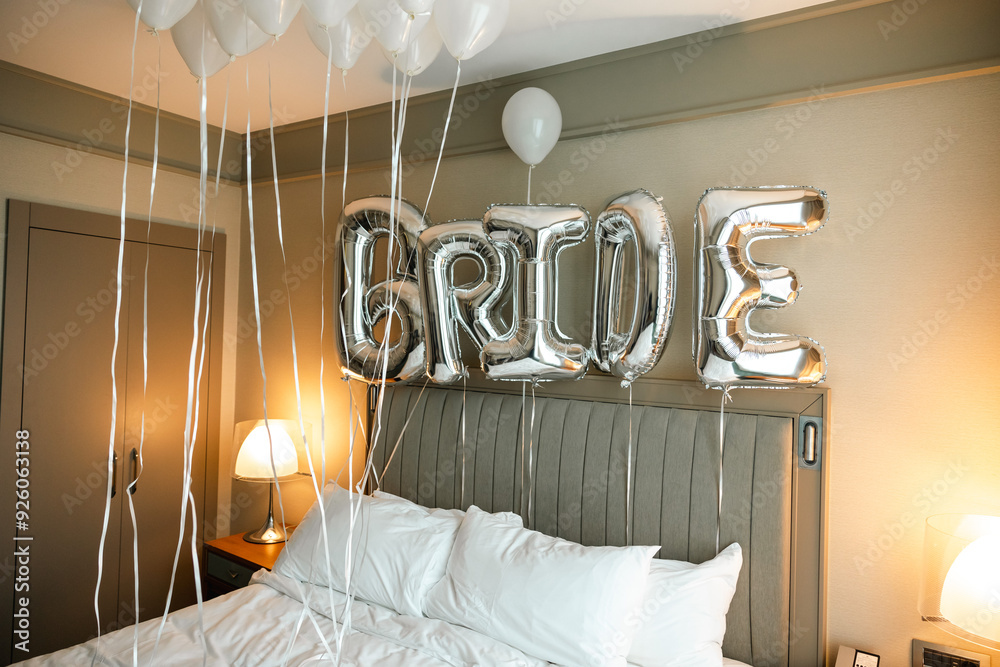 A bride's room decorated with silver foil balloons spelling out