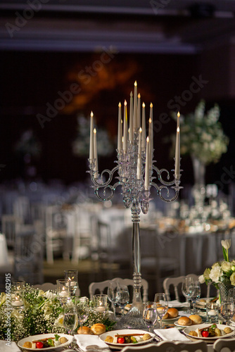 Indoor Wedding Reception: Long Table with Crystal Candelabras and Floral Runner