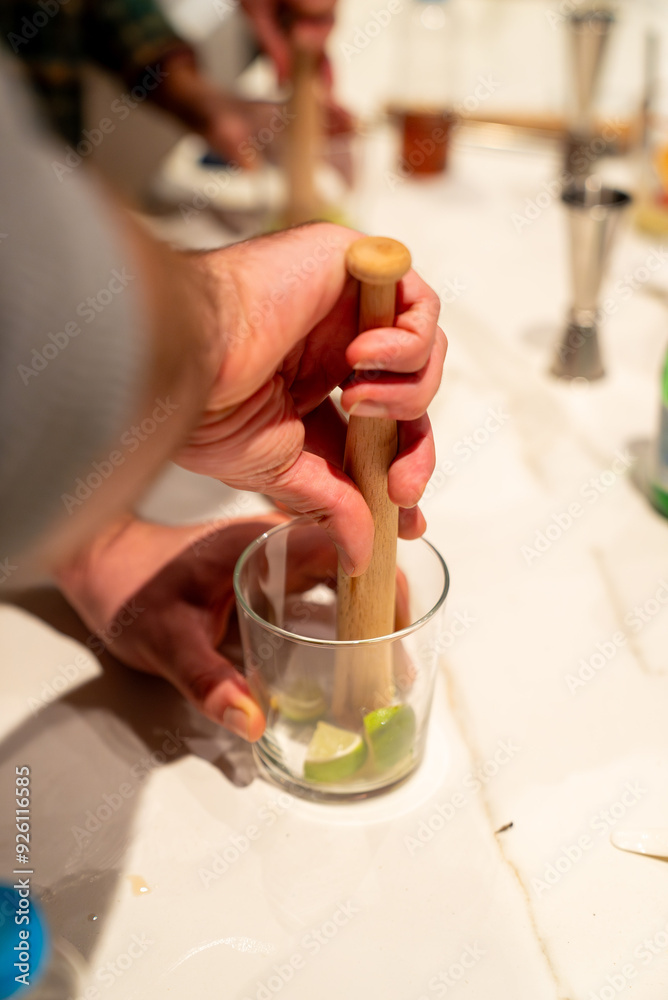 The art of mixology: A bartender muddling ingredients for a custom cocktail