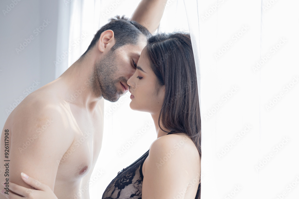 Fototapeta premium Silhouette Passionate Couple Kissing Each Other