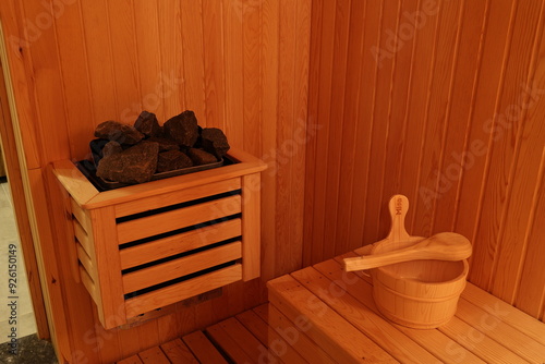 Traditional Finnish sauna with wooden walls and stove