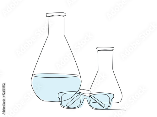 Two laboratory beakers contain liquid, accompanied by a pair of protective glasses, emphasizing safety in scientific experimentation.