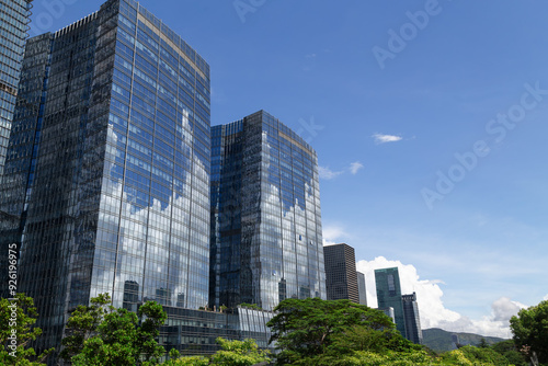 View of multi-story high-rise buildings made of glass and metal