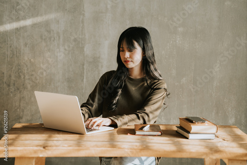 Asian woman working with laptop photo