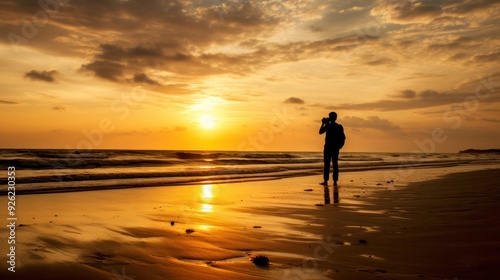 Silhouette of a person in a casual pose on a sandy beach