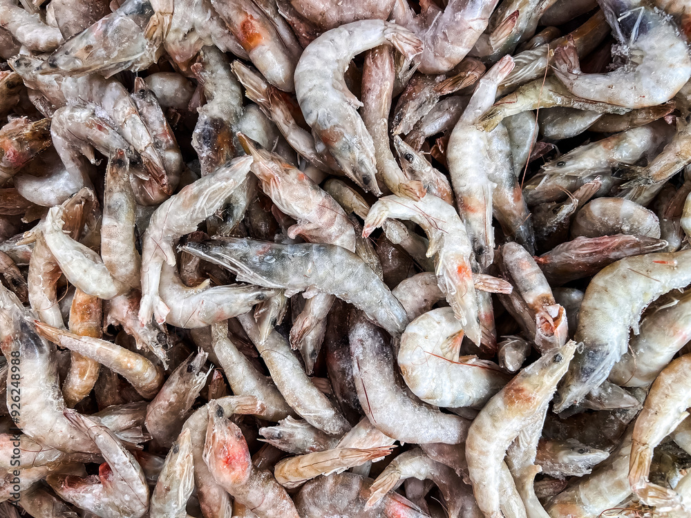 Frozen shrimps prawns. Raw shrimp background. Pile of frozen shrimps background. Frozen shrimps prawns. Raw shrimp background. Pile of frozen shrimps background.