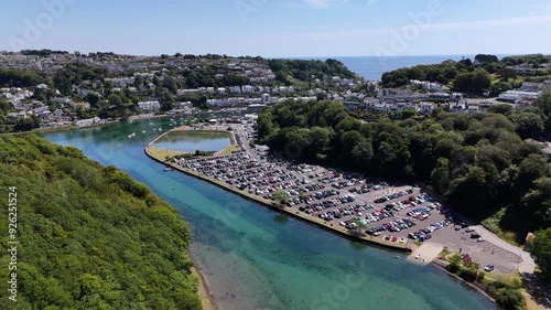 Aerial footage of Millpool Car Park and Mill Pool on West Looe River in Looe, Cornwall, England, UK photo