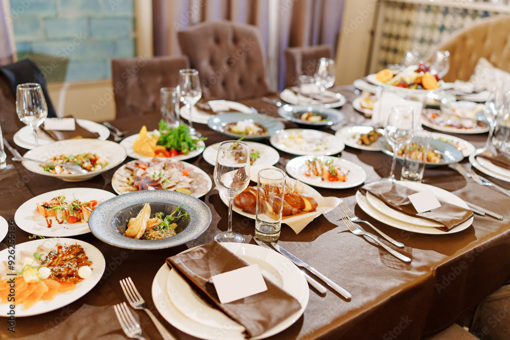 a large served festive table with appetizers. catering services for a holiday at home. a large served festive table with appetizers. catering services for a holiday at home.