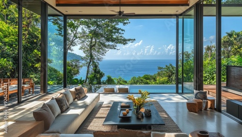Modern living room with ocean view and pool.