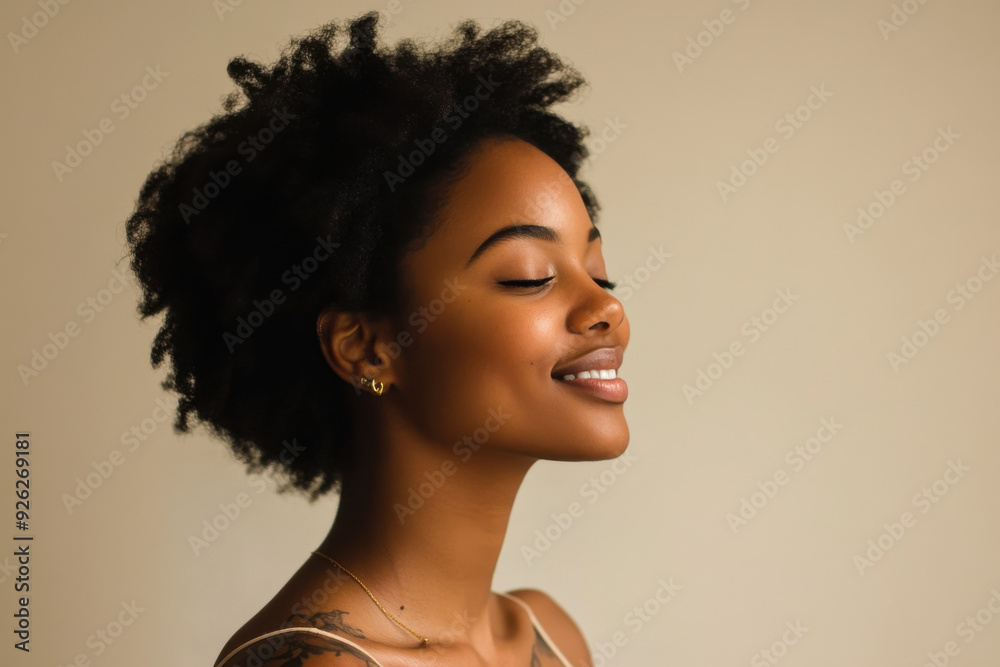 A close up of a tattooed black woman's face with her eyes closed A close up of a tattooed black woman's face with her eyes closed
