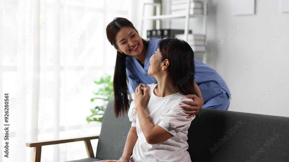 Nurse bonding with joyful elderly patient at home. Caring nurse holds hands with a smiling elderly woman, offering emotional support and building trust in a comfortable home setting. Nurse bonding with joyful elderly patient at home. Caring nurse holds hands with a smiling elderly woman, offering emotional support and building trust in a comfortable home setting.