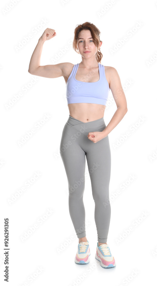 Woman with slim body showing muscles on white background Woman with slim body showing muscles on white background