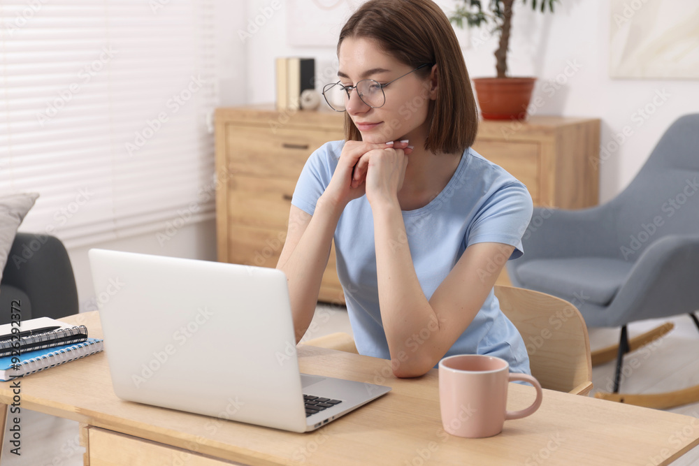 Teenager working with laptop at home. Remote job Teenager working with laptop at home. Remote job