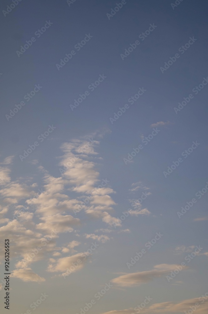 Morning sky in rural Ukraine with soft, scattered clouds against a clear blue background, capturing the peaceful beginning of a new day. Morning sky in rural Ukraine with soft, scattered clouds against a clear blue background, capturing the peaceful beginning of a new day.