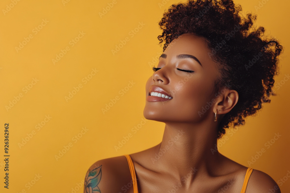 A close up of a tattooed black woman's face with her eyes closed A close up of a tattooed black woman's face with her eyes closed