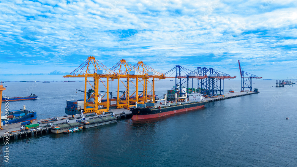 crane loading cargo container from truck to container ship in the international terminal logistic sea port concept freight shipping by ship. industry transportaion crane loading cargo container from truck to container ship in the international terminal logistic sea port concept freight shipping by ship. industry transportaion