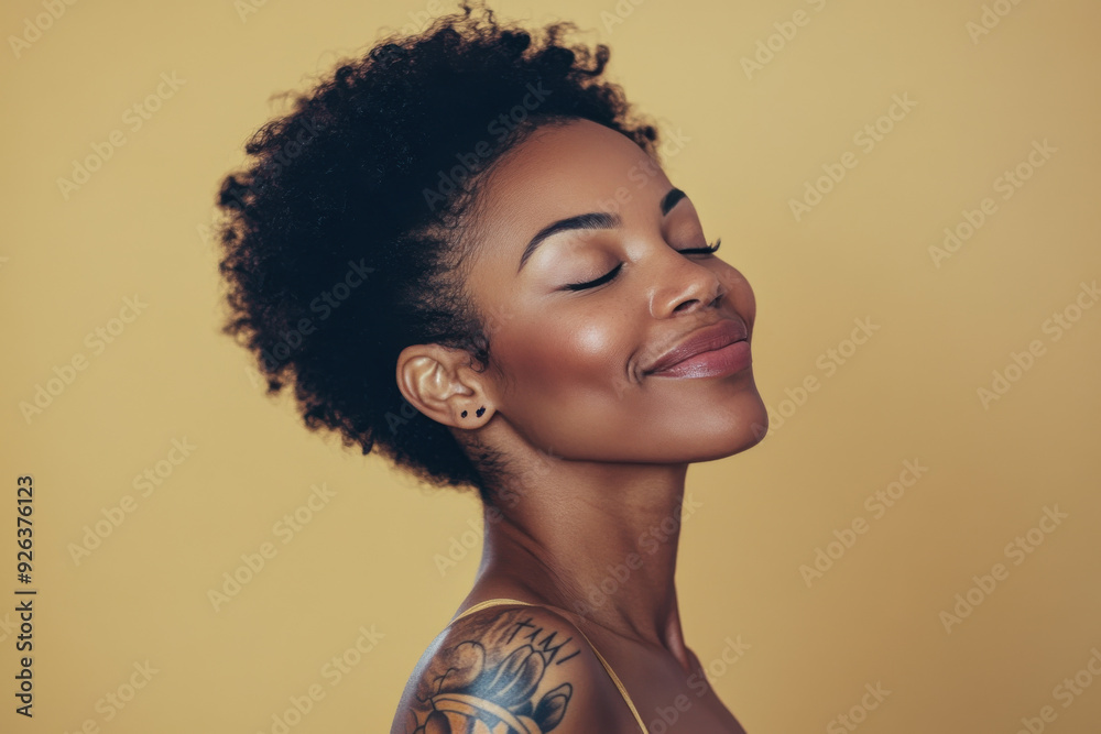 A close up of a tattooed black woman's face with her eyes closed