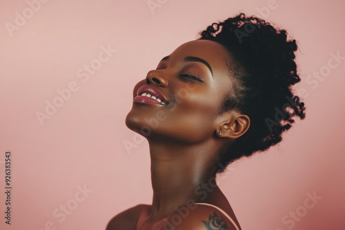 A close up of a tattooed black woman's face with her eyes closed