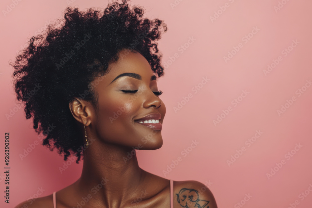 A close up of a tattooed black woman's face with her eyes closed A close up of a tattooed black woman's face with her eyes closed
